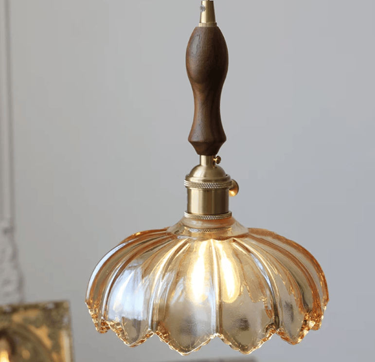 Vintage glass flower pendant light by eprolo featuring a minimalist design with a clear glass flower-shaped shade.
