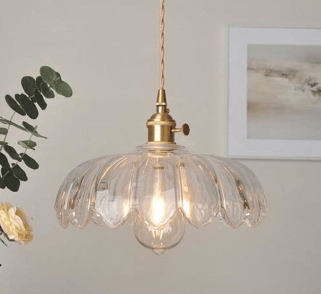 Vintage glass flower pendant light by eprolo featuring a minimalist design and clear glass flower shape.