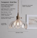 Vintage glass flower pendant light by eprolo with a minimalist design, featuring a clear glass flower-shaped shade hanging from a sleek fixture.