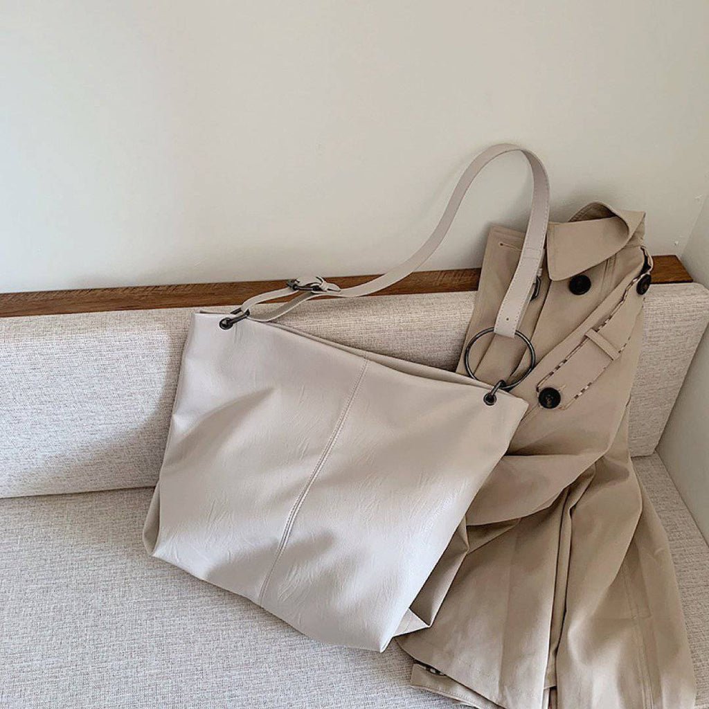 Nehwei enterprise CeCe shoulder bag with adjustable strap, stylish design, and spacious interior, shown in the image.
