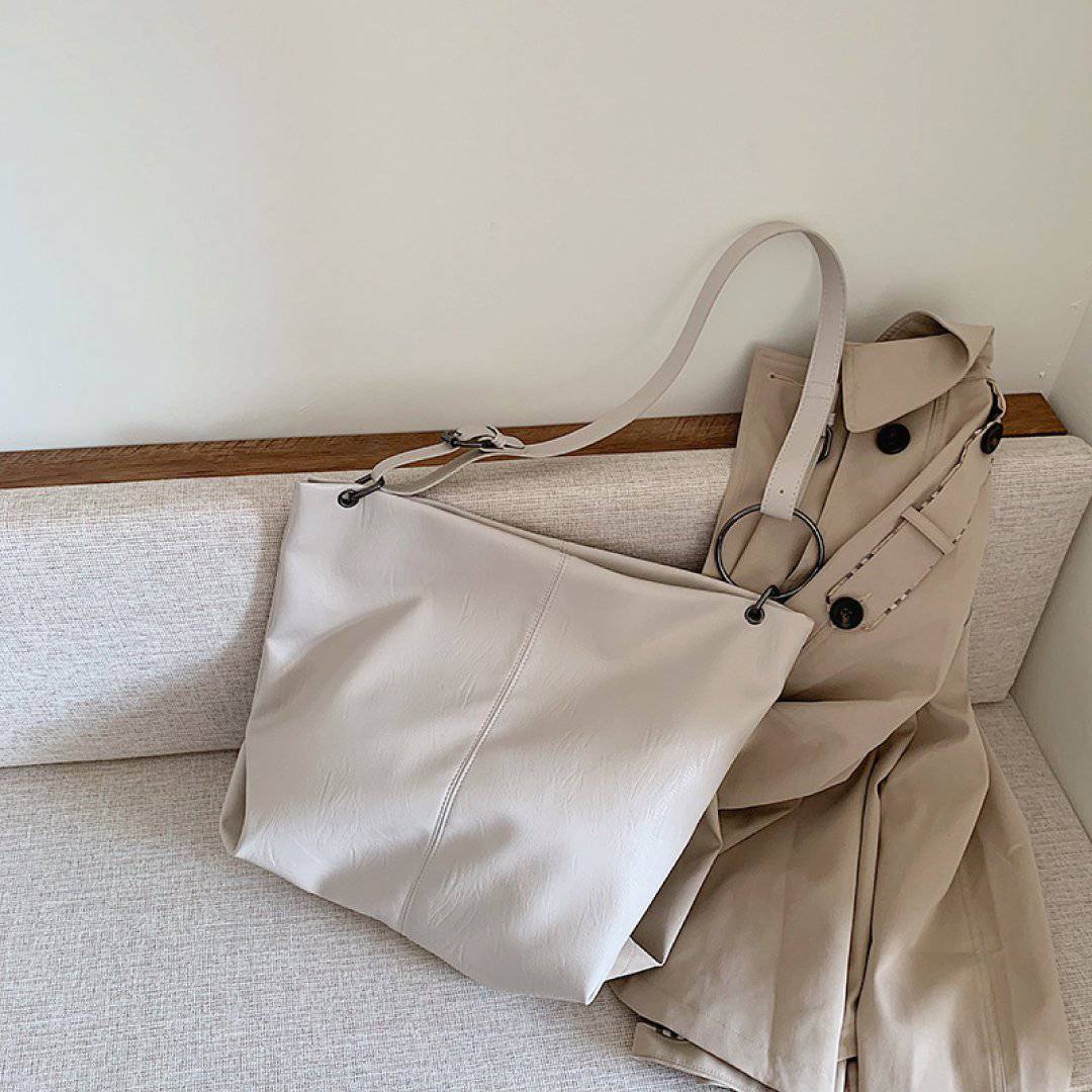 Nehwei enterprise CeCe shoulder bag with adjustable strap, stylish design, and spacious interior, shown in the image.