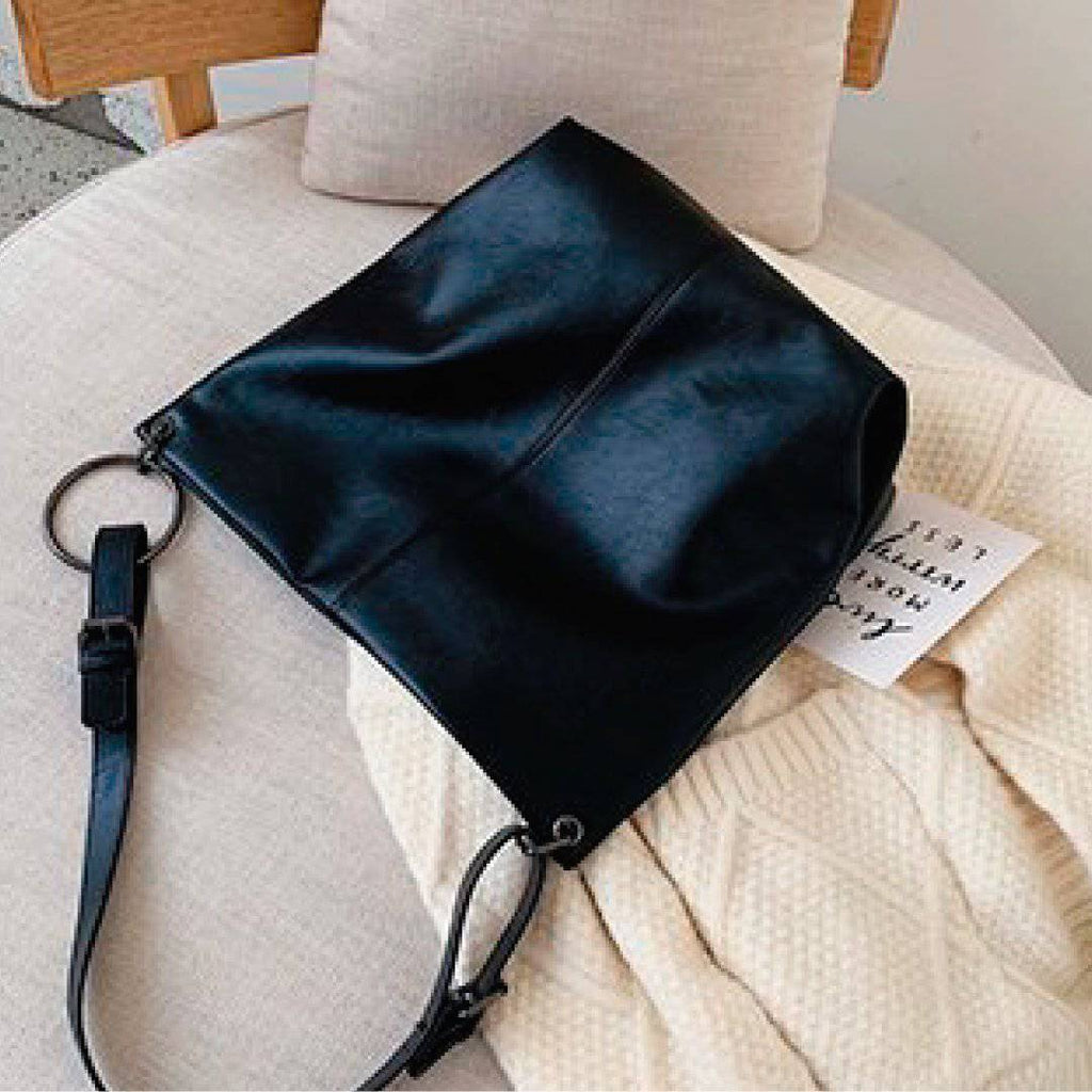 Nehwei enterprise CeCe shoulder bag in black leather with silver hardware and adjustable strap.