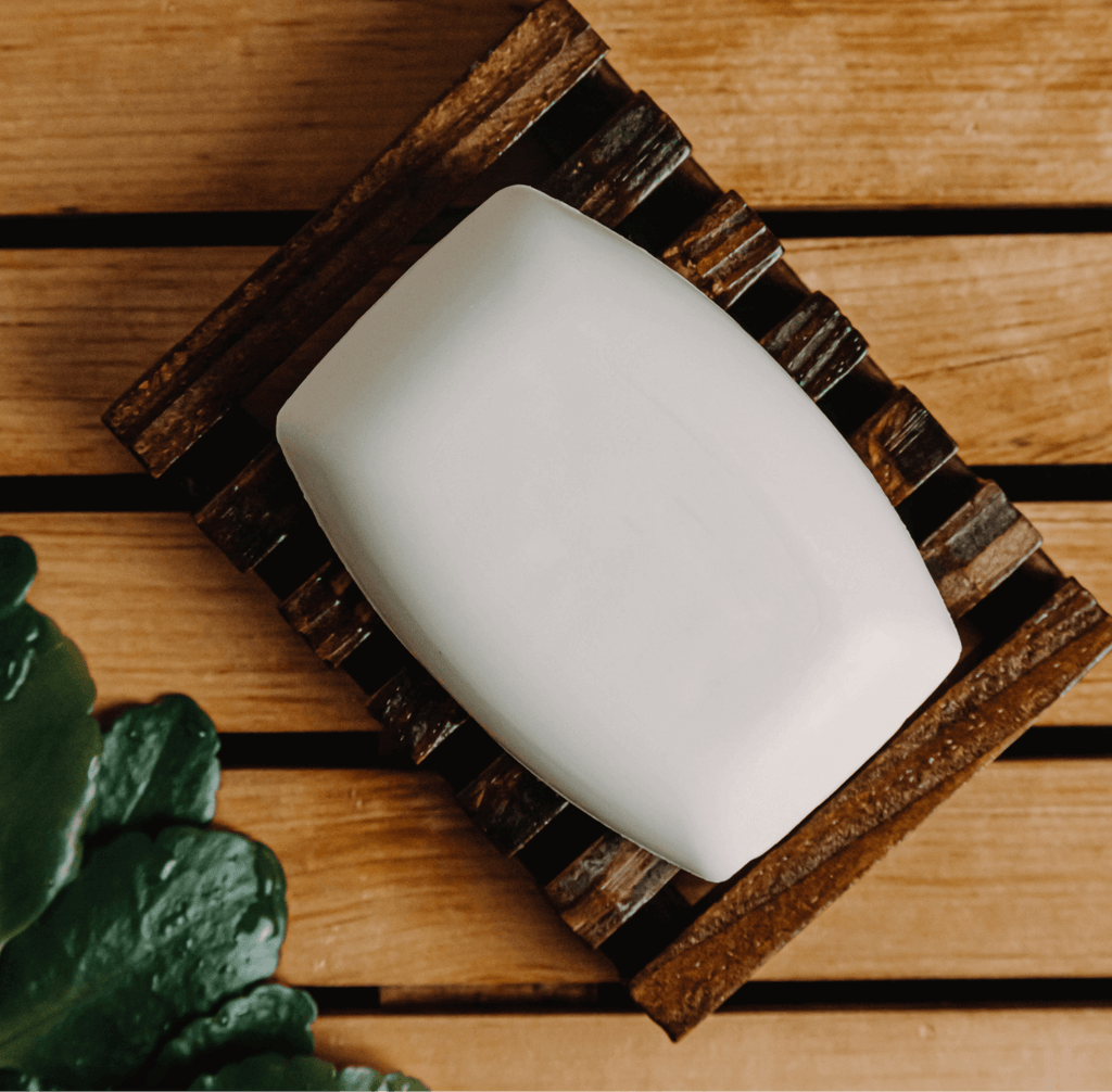 Cream-colored coconut bar soap by My Store with a smooth rectangular shape, shown in a close-up image.