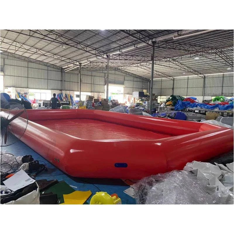 Large inflatable PVC outdoor swimming pool by Nehwei enterprise, shown set up on ground with clear blue water and surrounding pool area.