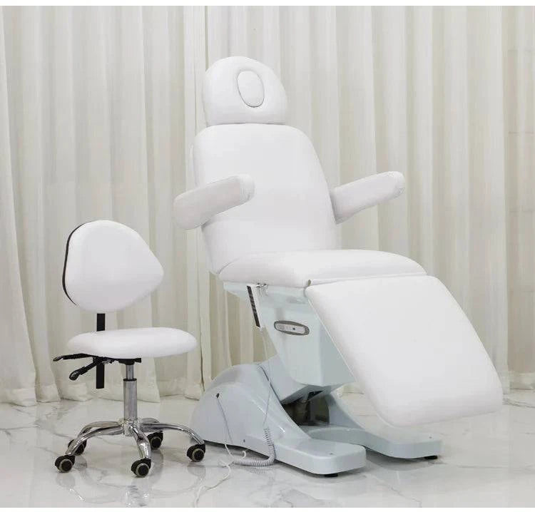 Luxury electric massage table by Nehwei Enterprise with modern design, adjustable headrest, and plush upholstery for professional esthetic treatments.