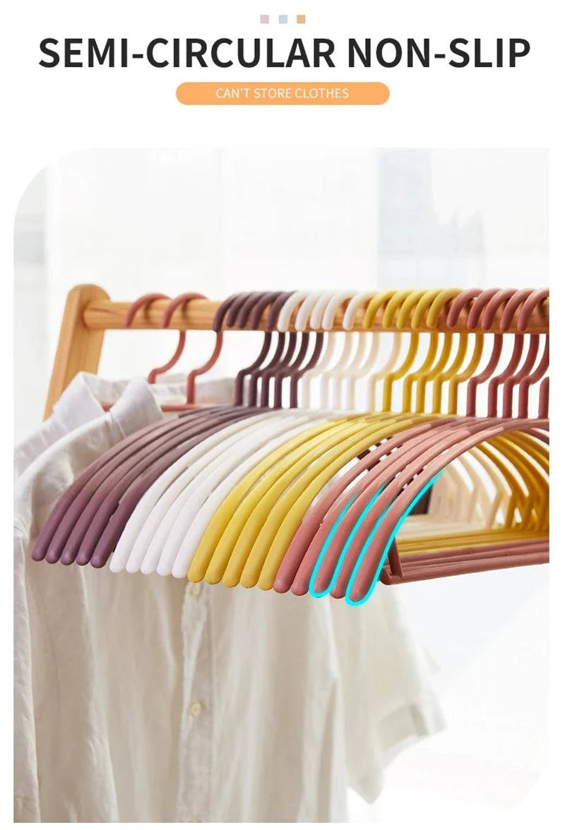 Plastic household clothes hanger with arc design, wide shoulders, semi-circular shape, seamless hanging organizer by Nehwei enterprise.