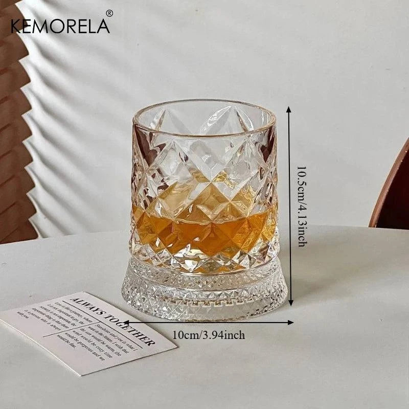 Nehwei enterprise 360-degree rotating crystal whisky glass with thick base, ideal for bourbon and scotch, shown on a wooden surface