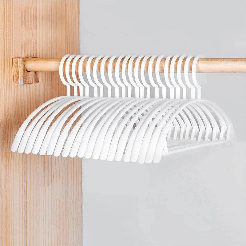 Plastic household clothes hanger with arc design, wide shoulders, semi-circular shape, seamless hanging organizer by Nehwei enterprise.