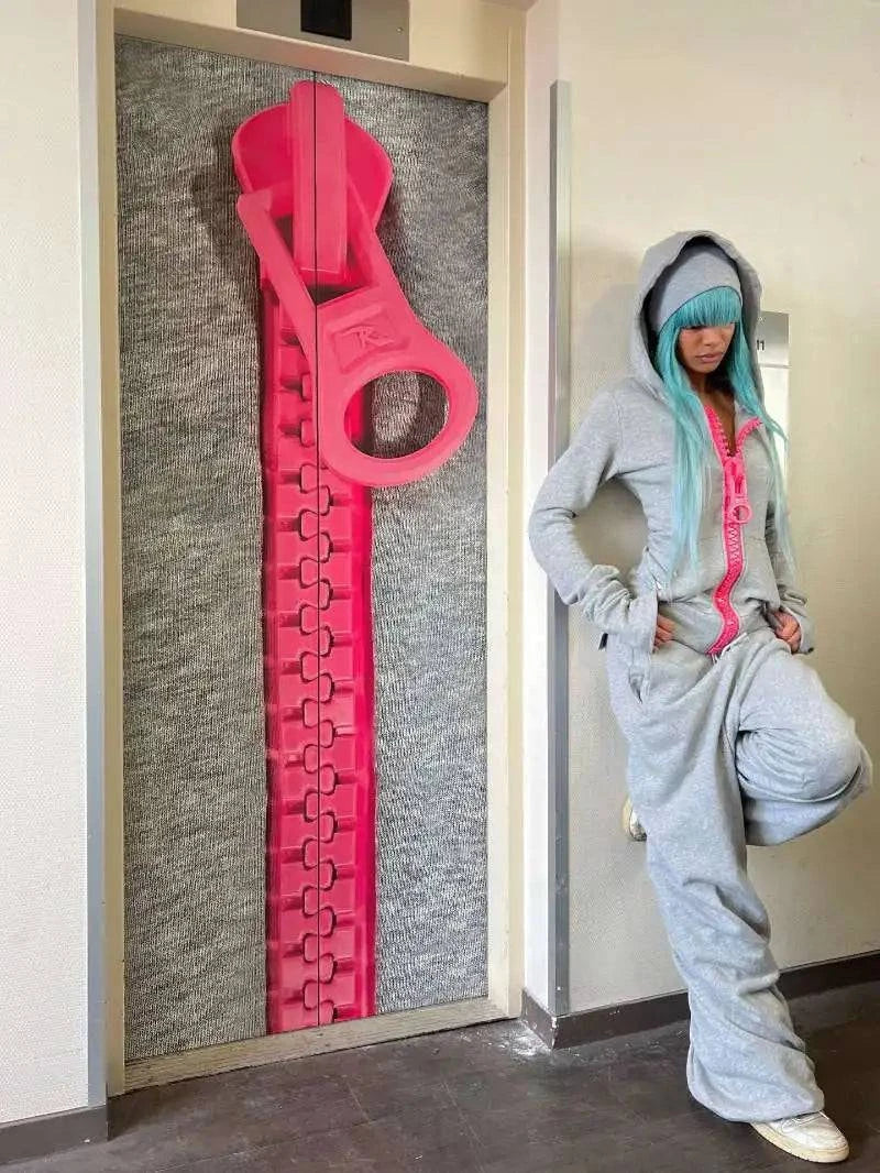 Loose oversized Y2K street style hoodie by Nehwei Enterprise, solid color with zipper and multiple pockets for women.