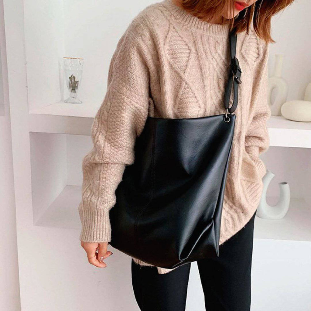 Nehwei Enterprise CeCe shoulder bag in stylish leather, featuring a sleek design with a top handle and adjustable shoulder strap.