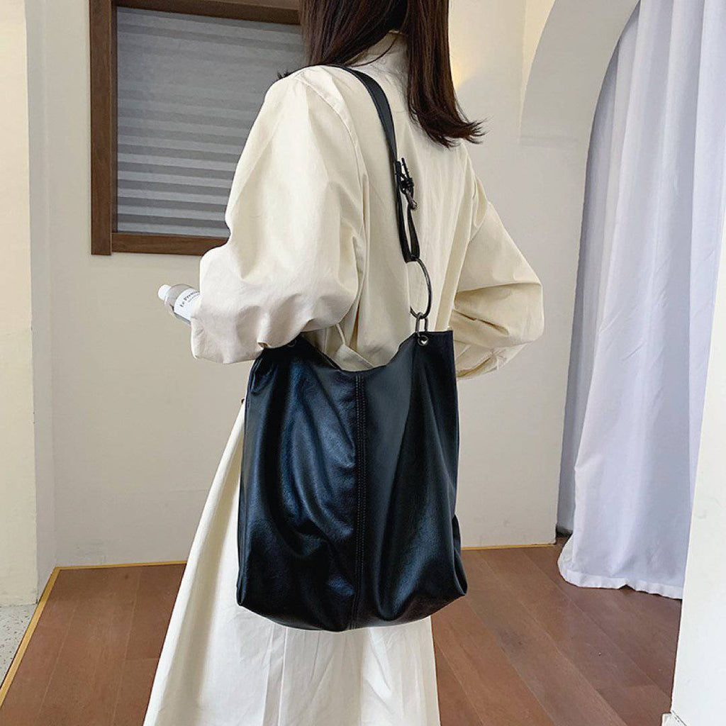 Nehwei Enterprise CeCe Shoulder Bag in neutral tone, featuring sleek design with shoulder strap and subtle branding details.