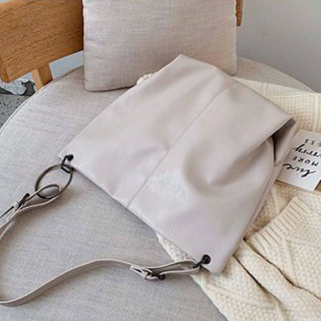 Nehwei enterprise CeCe shoulder bag in beige with gold hardware, featuring a stylish design and adjustable strap.