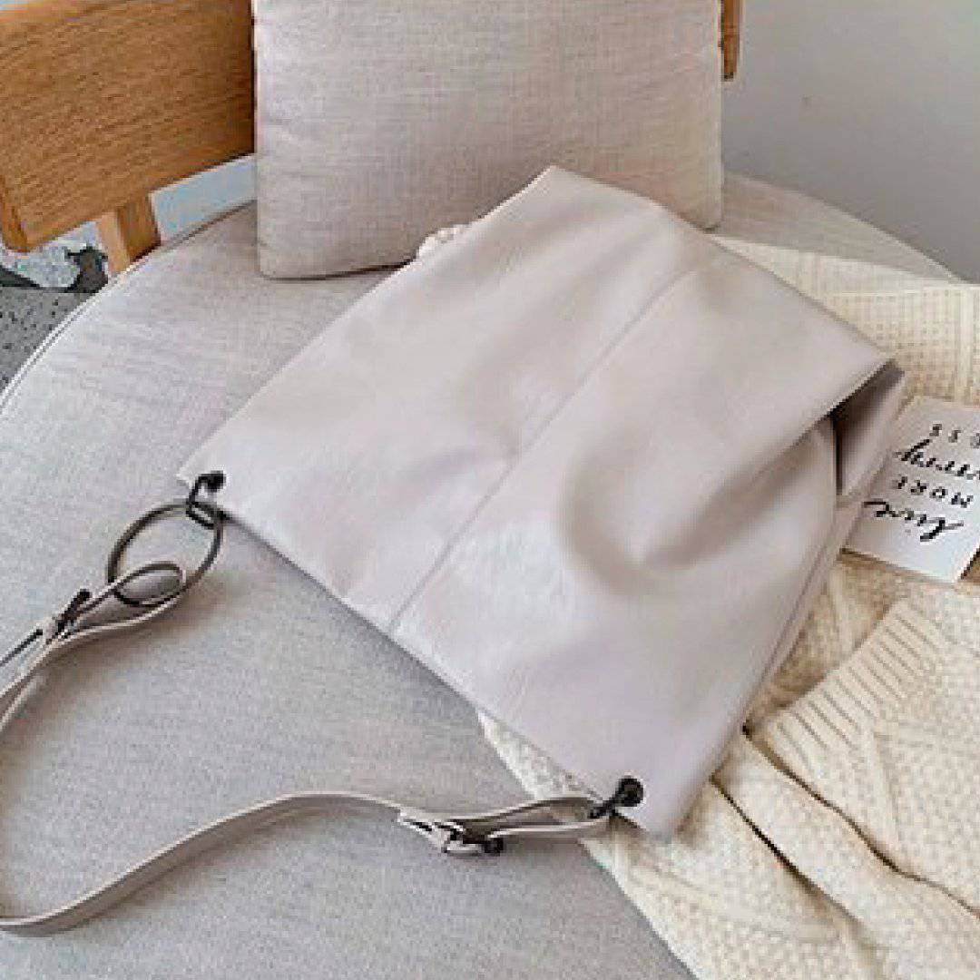 Nehwei enterprise CeCe shoulder bag in beige with gold hardware, featuring a stylish design and adjustable strap.