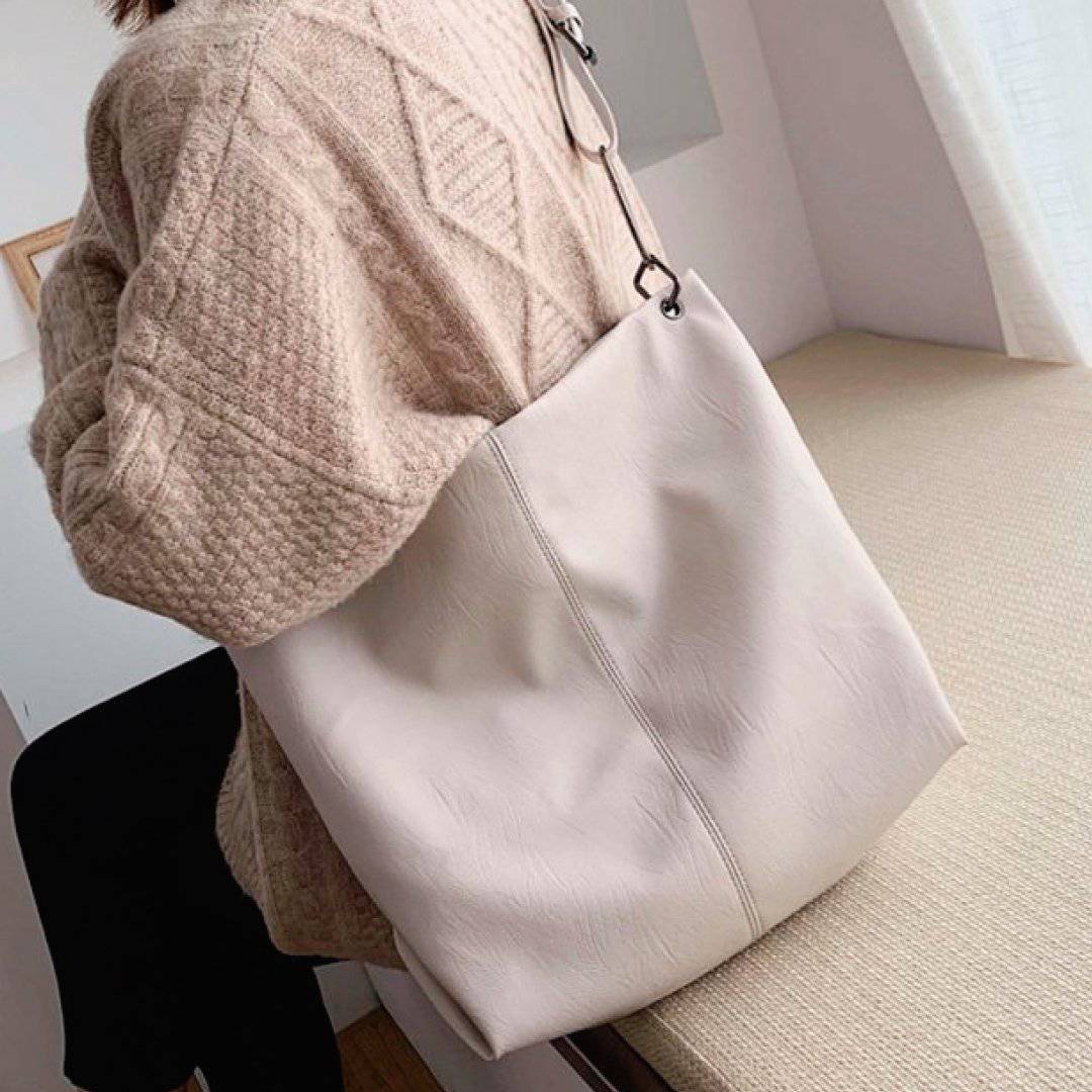 Nehwei Enterprise CeCe Shoulder Bag in black leather with silver hardware, featuring a flap closure and adjustable strap.