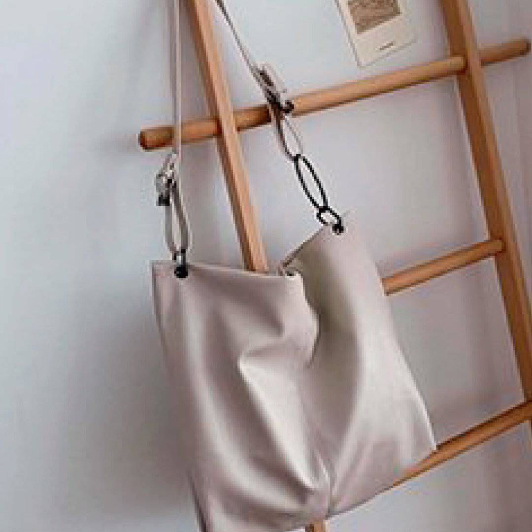 Nehwei Enterprise CeCe shoulder bag in stylish leather with top handle and shoulder strap, featuring a sleek, modern design.