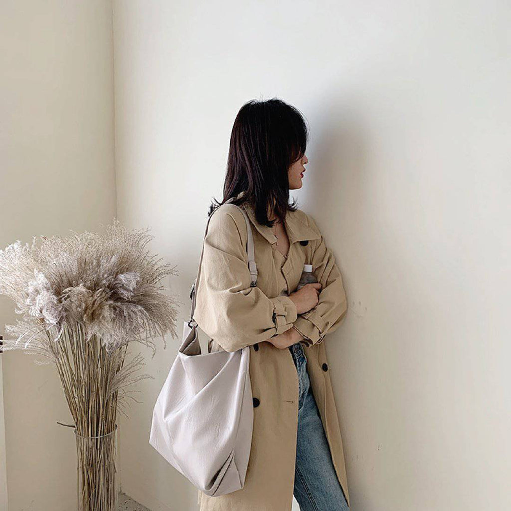 Nehwei Enterprise CeCe shoulder bag in brown leather with adjustable strap and stylish design, displayed on a plain background.